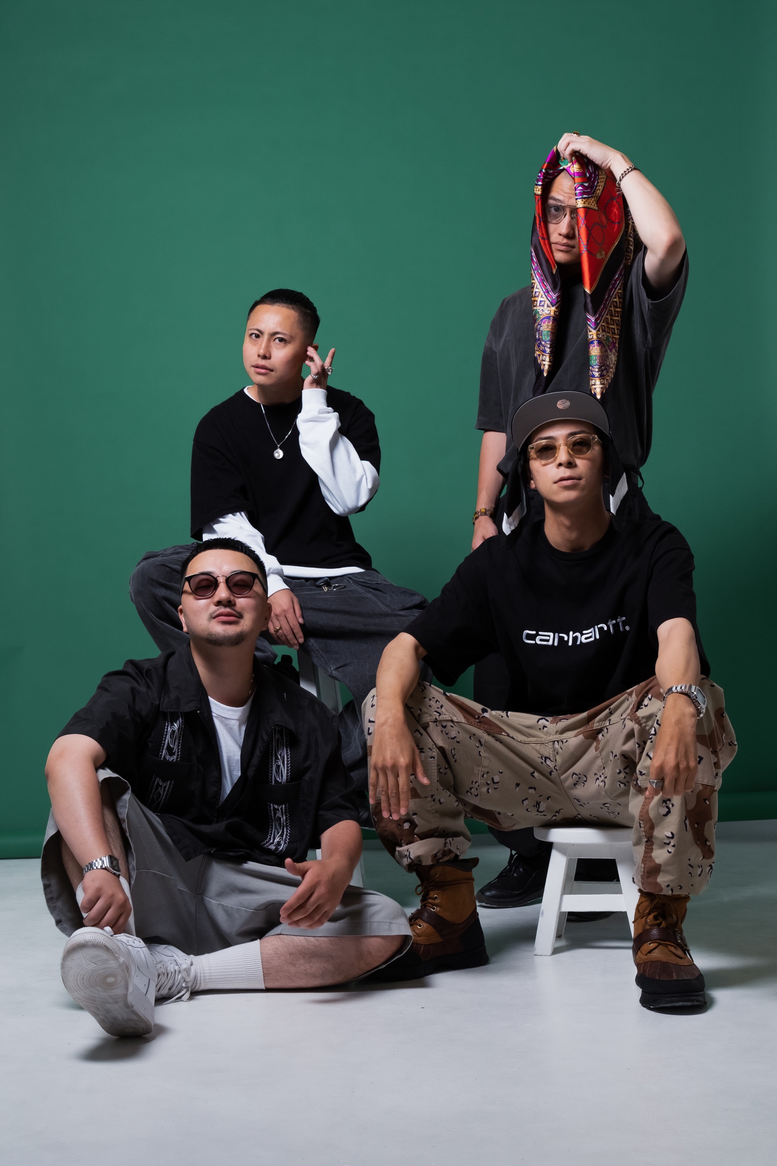 Contrail Club, a four-member hip-hop crew against a green backdrop